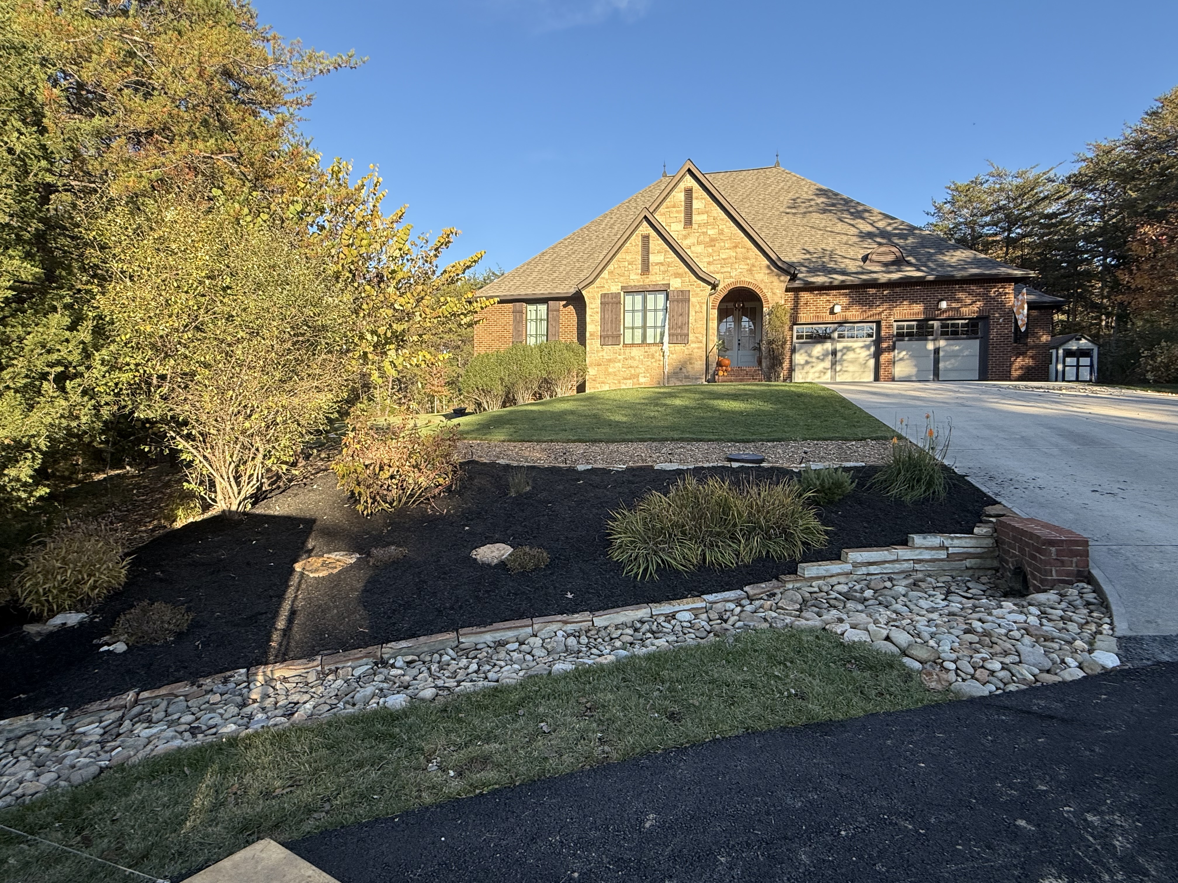 Natural stone hardscape and landscape installation on a Lenoir City, TN lakefront property